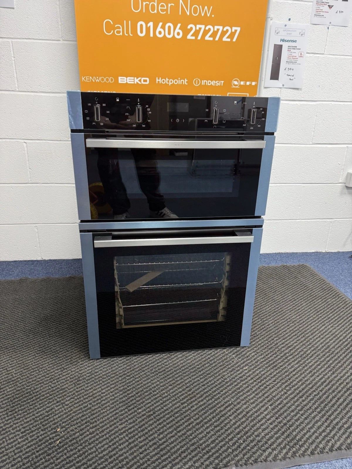 Neff N50 U1ACE2AN3B Built-in Electric Double Oven in Stainless Steel - A/B Rated by HomeWise Appliances. Showroom photo with doors closed.
