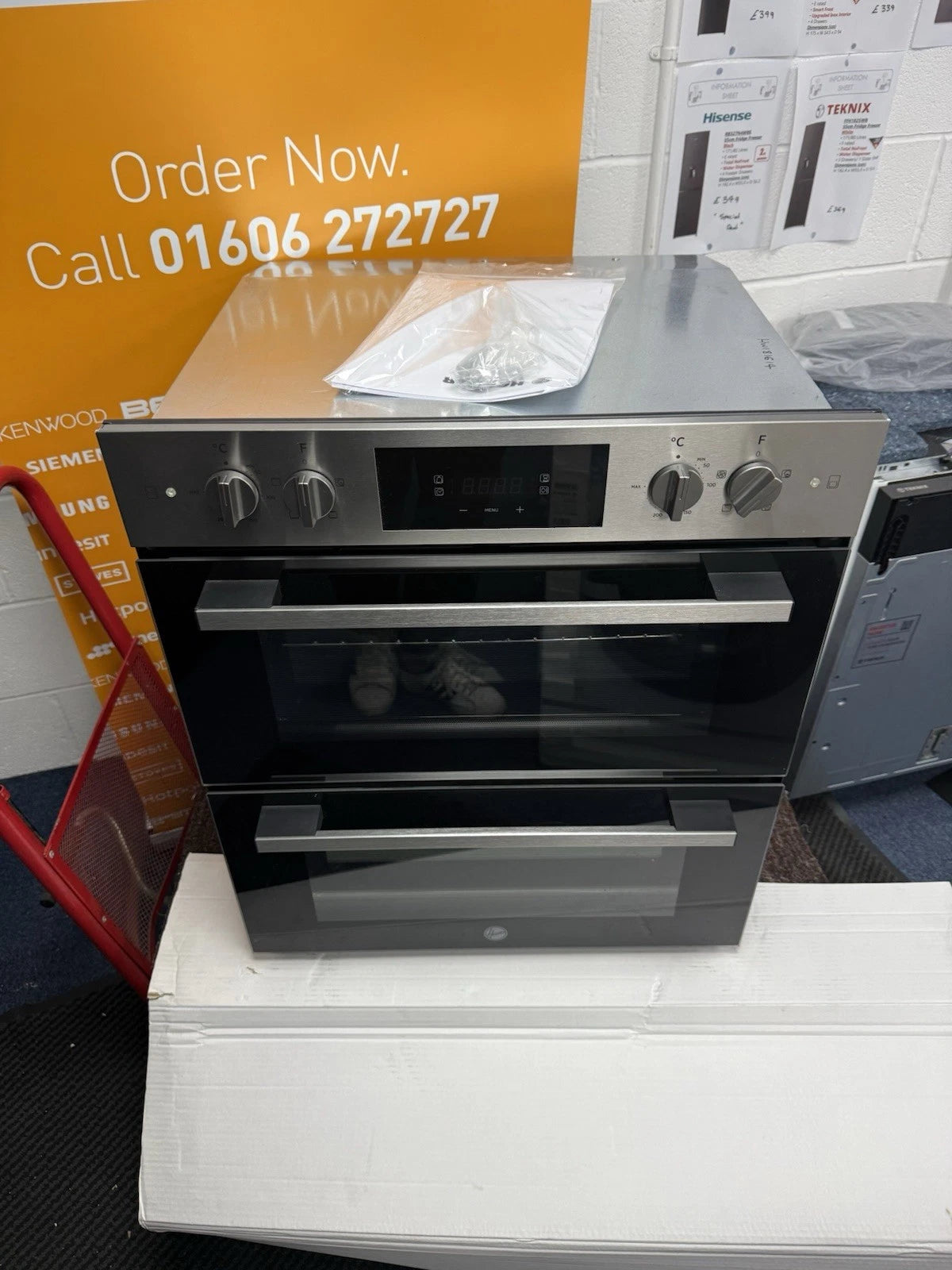Hoover HO7DC3B308IN Electric Built-under Double Oven in Stainless Steel & Black - A/A Rated from HomeWise Appliances. Shop photo front of the oven. Placed in front of a call to action sales banner. Order Now Call 01606 272727