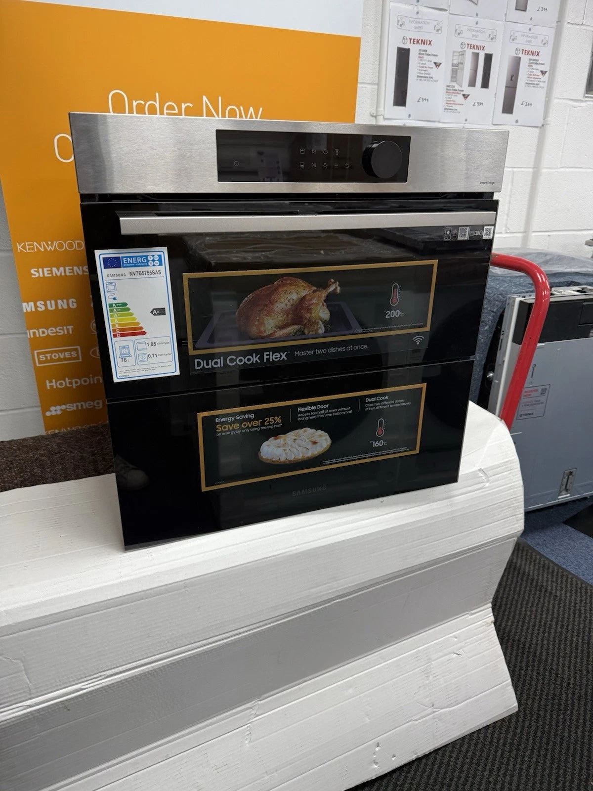Samsung NV7B5755SAS Flexible Dual Cook Built-in Smart Single Oven with Pyrolytic Self Cleaning and Air Fry in Stainless Steel - A+ Rated from HomeWise Appliances. Shop photo of angled front of the oven with Dual Cook branding.