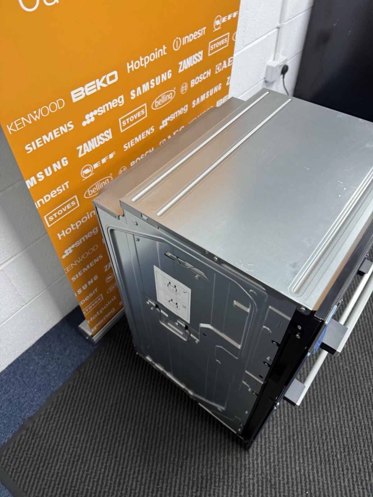 Neff N50 U1ACE2AN3B Built-in Electric Double Oven in Stainless Steel - A/B Rated by HomeWise Appliances. Showroom photo showing left side of the outer casing.