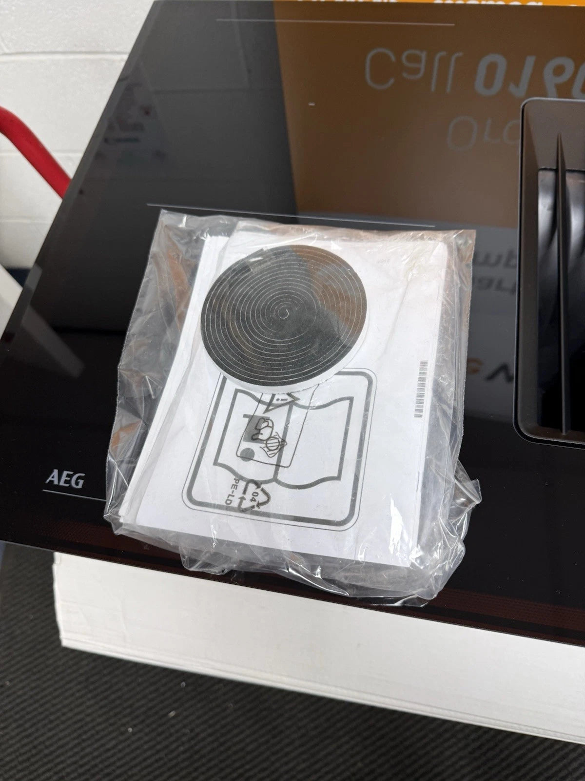 AEG Series 6000 TH84CB03FB (83) 81cm Induction Hob with Venting Extraction in Black - A+ Rated - (Display Stock) - HW181683 instruction manual and installation seal tape.