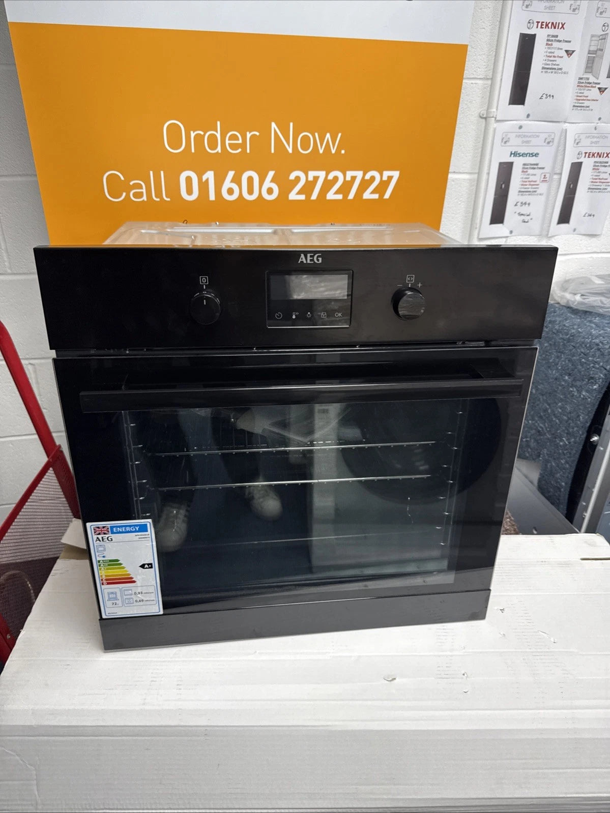AEG BPK355061B (20) Electric Built-In Single Oven with Pyrolytic Self Cleaning in Black - A+ Rated from HomeWise Appliances. Angled shop photo in front of call to action sales banner. Order now call 01606 272727