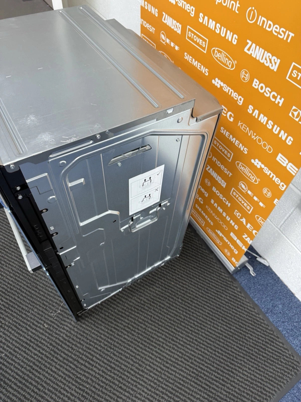 Neff N50 U1ACE2AN3B Built-in Electric Double Oven in Stainless Steel - A/B Rated by HomeWise Appliances. Showroom photo showing right side outer casing.