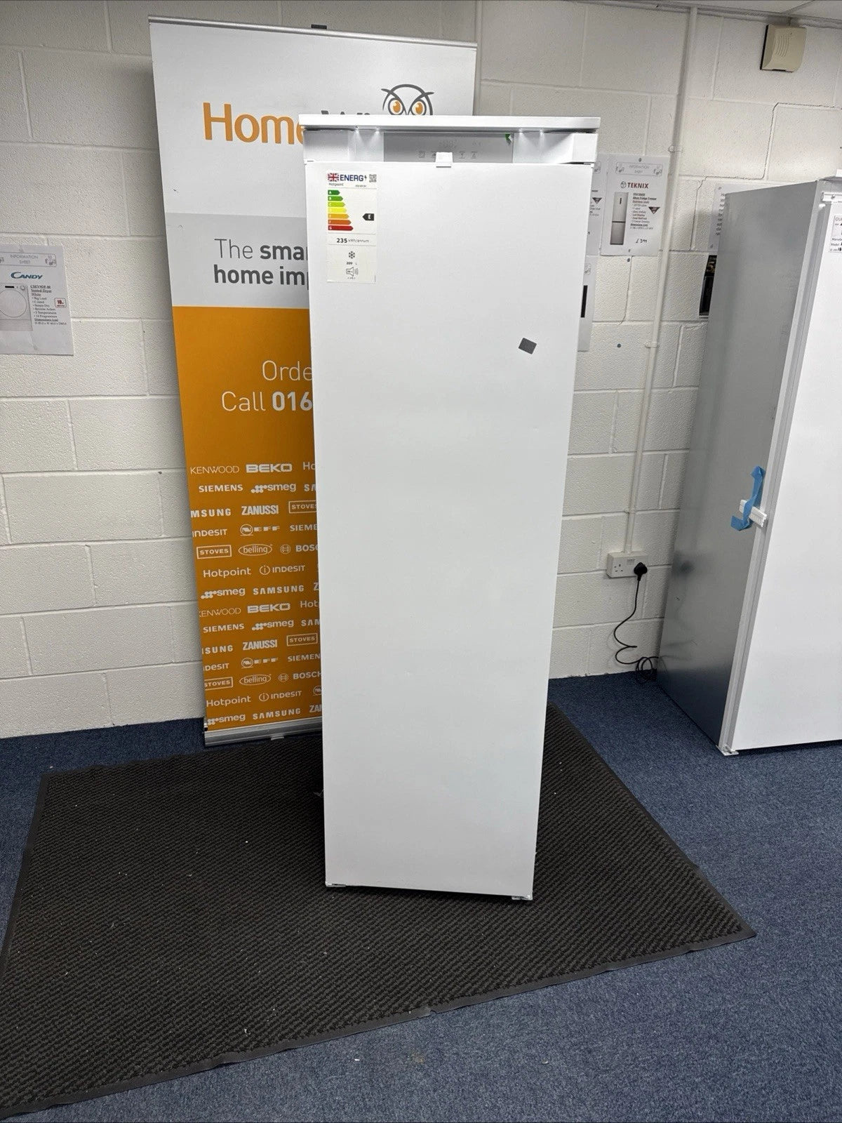 Hotpoint HTSD18F013H1 209 Litre Tall Built-In Freezer with No Frost - E Rated from HomeWise Appliances. shop photo showing front of the freezer with door closed.