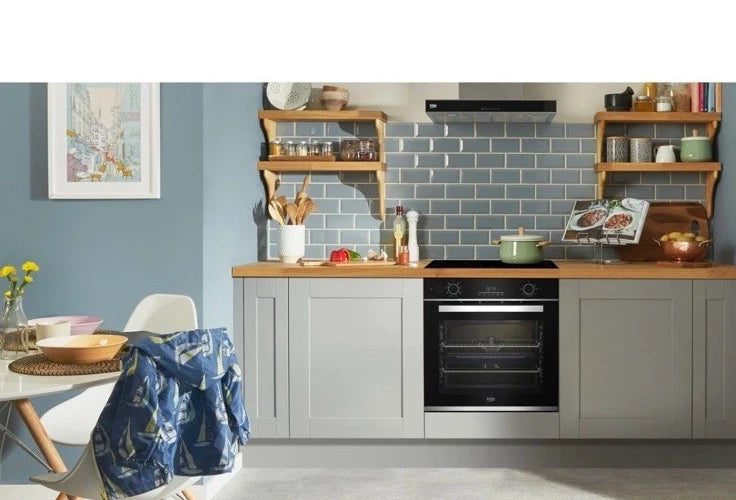 Beko Recycled Net® BBIS25300XC (83) Built-in Electric Single SimplySteam™ Oven with AeroPerfect™ - A Rated from HomeWise Appliances stock photo showing the oven as the centre piece of a family kitchen