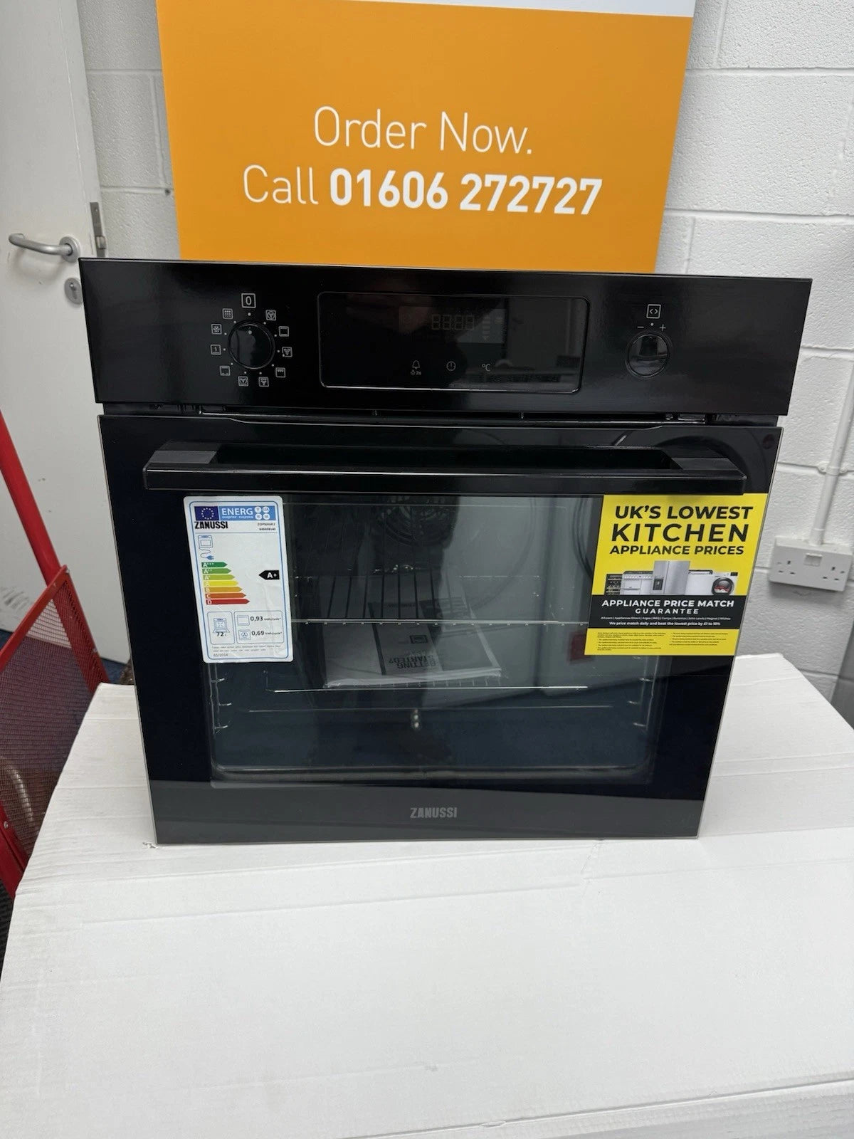 Zanussi ZOPNX6K2 Electric Single Oven with Pyrolytic Self Cleaning in Black - A+ Rated Showroom Photo front with door closed and sales banner