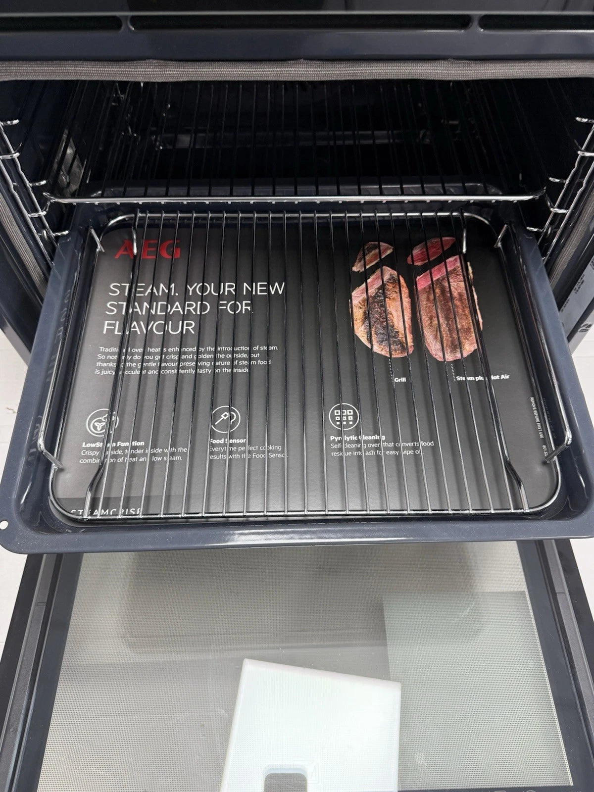 AEG 7000 BSK774320M SteamCrisp Built-In Single Oven with Pyrolytic Self Cleaning in Stainless Steel - A+ Rated (Blemished) Showroom photo pull ou tray