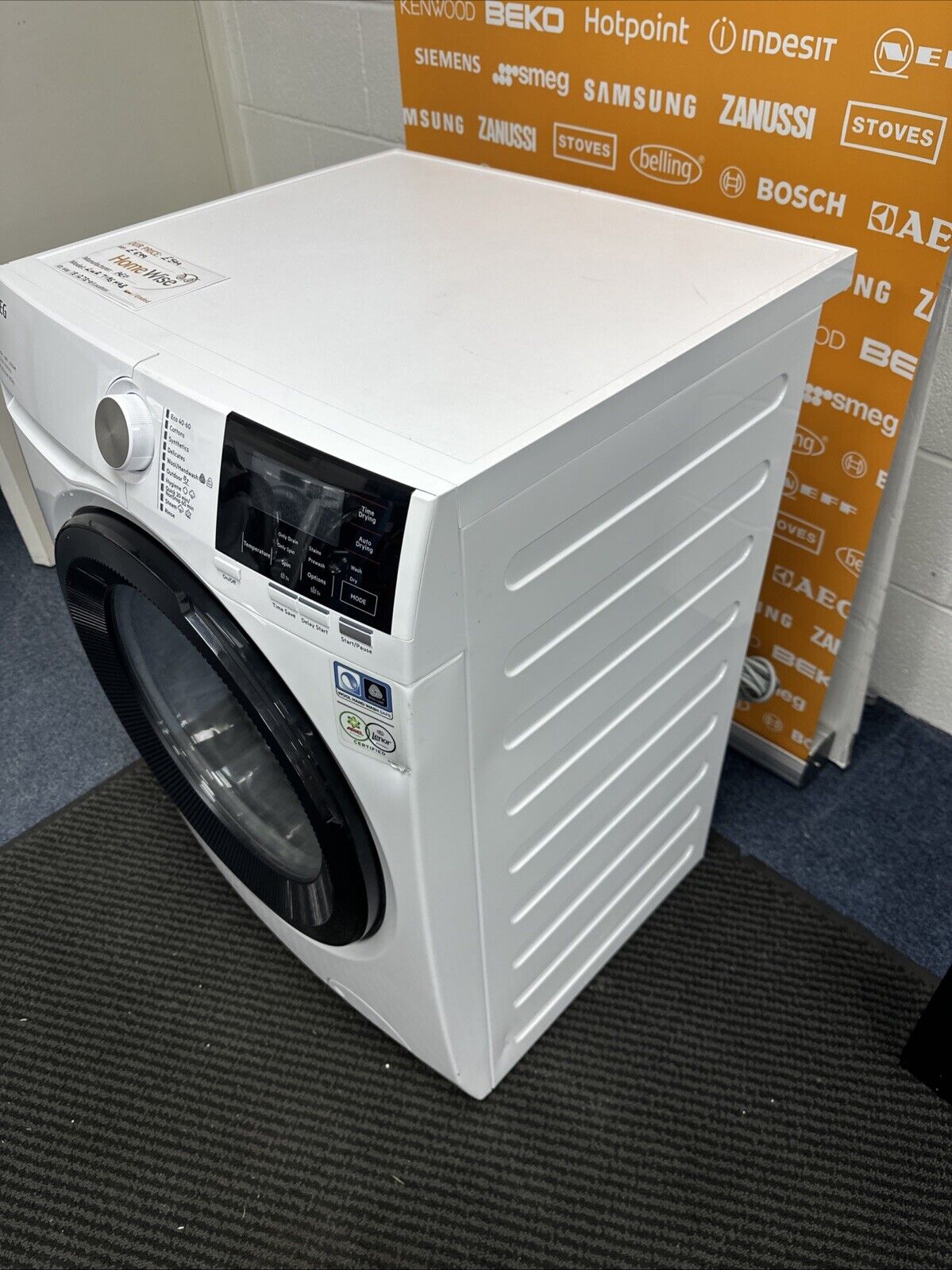 AEG 7000 ProSteam® LWR7185M4B 8+5KG 1400 Spin Washer Dryer in White - A Rated on Wash - Graded showroom photo close up of right side panel