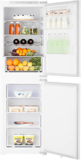 Teknix BITH50FF/E 50/50 Integrated Fridge Freezer with Total No Frost - 233 Litres - E Rated Stock Photo front door open with items inside