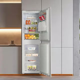 Teknix BITH50FF/E 50/50 Integrated Fridge Freezer with Total No Frost - 233 Litres - E Rated Stock Photo doors open fitted into a kitchen unit