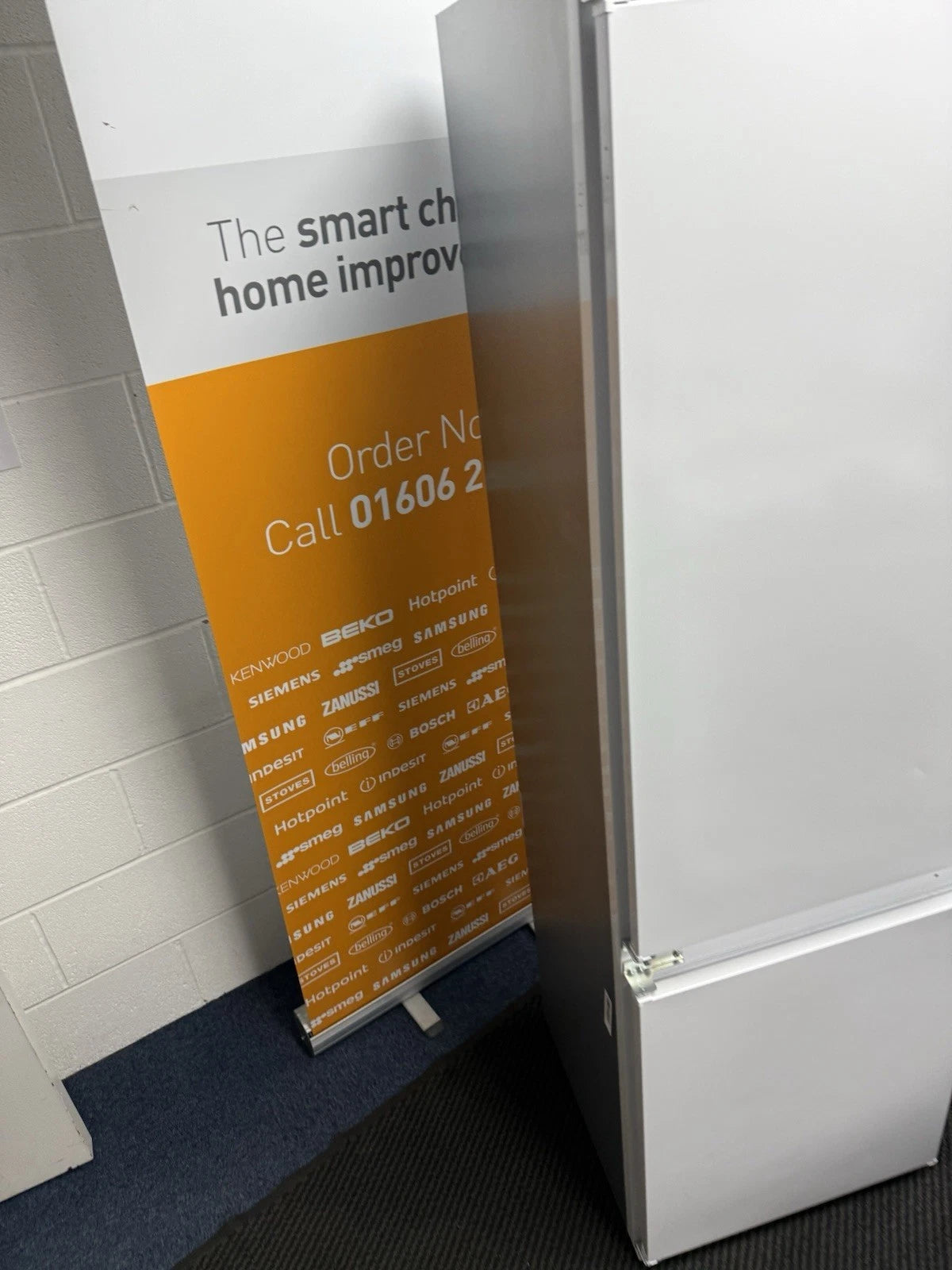 Hotpoint HTC18 T112 UK 70/30 No Frost Integrated Fridge Freezer with Sliding Hinge - E Rated from HomeWise Appliances. Shop photo of the left side panel of the fridge freezer.
