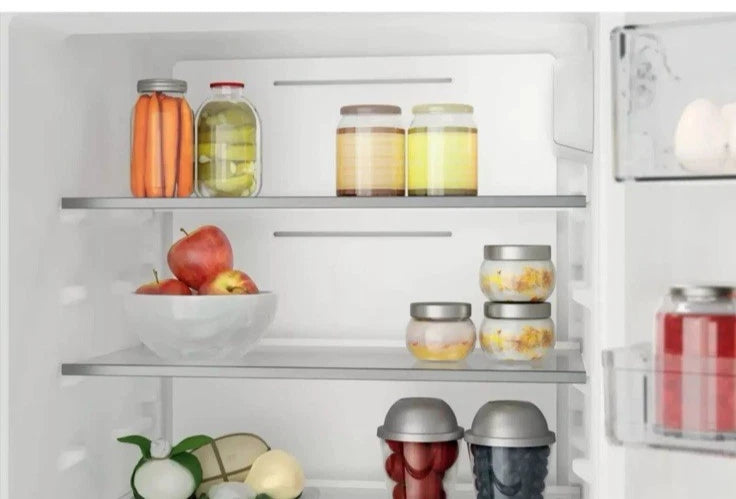 Hotpoint HTC18 T112 UK 70/30 No Frost Integrated Fridge Freezer with Sliding Hinge - E Rated from HomeWise Appliances. Stock photo close up of contents on the fridge shelves