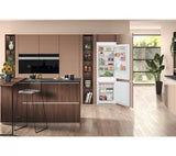 Hotpoint HTC18 T112 UK 70/30 No Frost Integrated Fridge Freezer with Sliding Hinge - E Rated from HomeWise Appliances. Stock photo of the fridge freezer in a open plan kitchen setting.