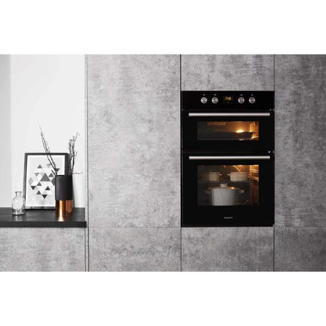 Hotpoint Series 2 DD2 844 C BL Double Built-in Oven in Black - A/A Rated from HomeWise Appliances stock photo of oven in a kitchen wall display