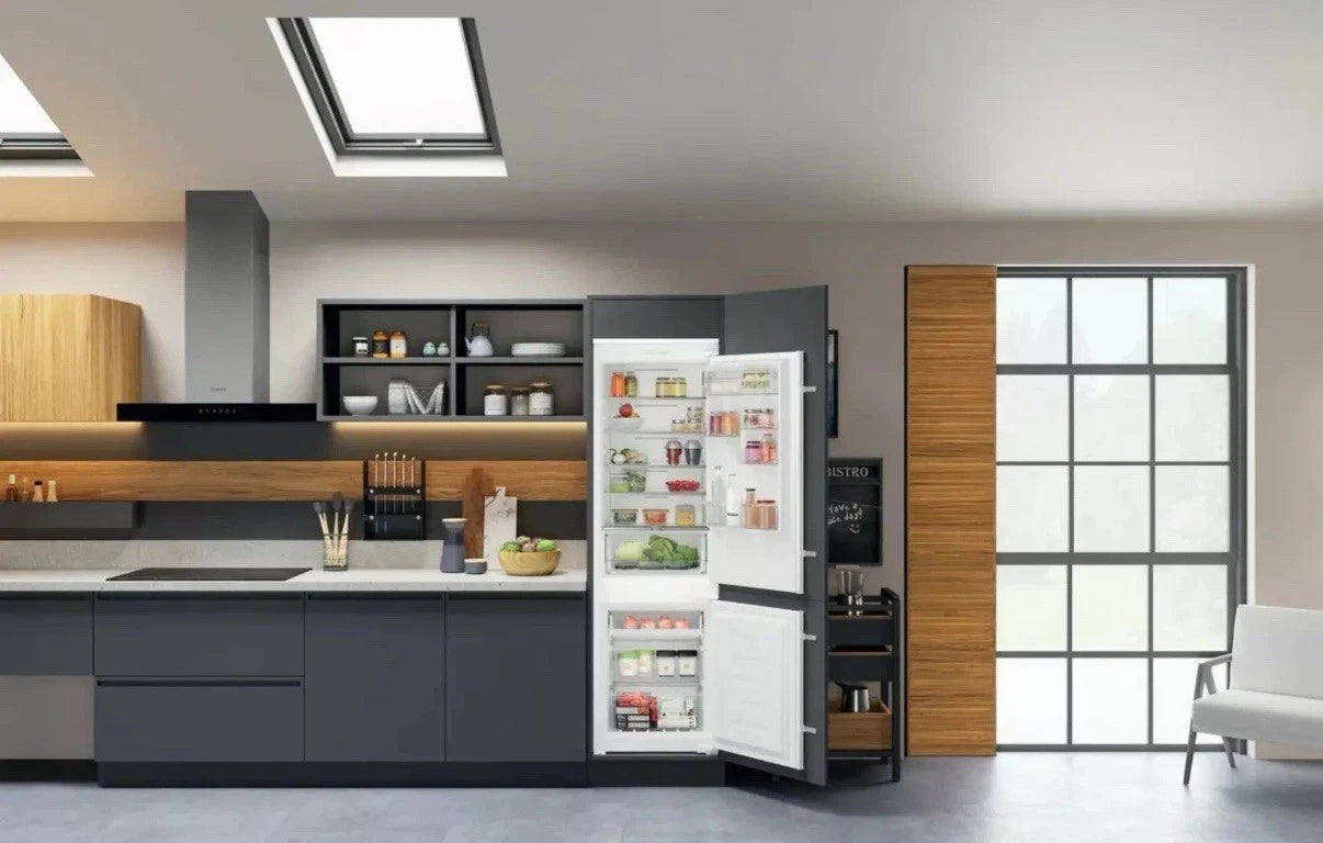 Hotpoint HTC18 T112 UK (17) 70/30 No Frost Integrated Fridge Freezer with Sliding Hinge - E Rated from HomeWise Appliances. Stock photo with fridge freezer in a kitchen display