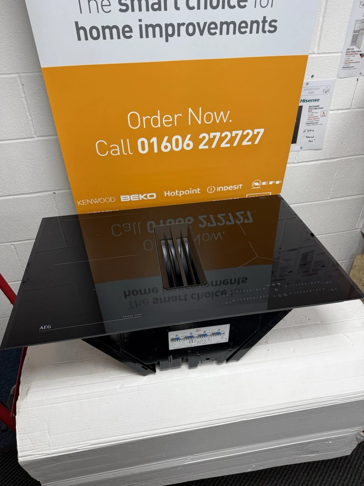 AEG Series 6000 TH84CB03FB (83) 81cm Induction Hob with Venting Extraction in Black - A+ Rated - (Display Stock) - HW181683 in front of a call to action sales banner. Call Now 01606 272727