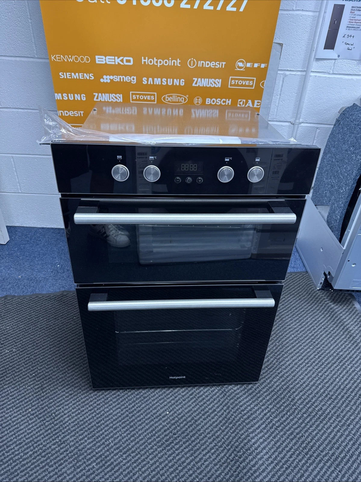 Hotpoint Series 2 DD2 844 C BL Double Built-in Oven in Black - A/A Rated from HomeWise Appliances shop photo close up of the oven showing bar handles for a sleek modern look in a fitted kitchen