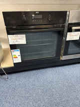 AEG BPK355061B (20) Electric Built-In Single Oven with Pyrolytic Self Cleaning in Black - A+ Rated from HomeWise Appliances. Shop photo of oven on show stand with the door closed showing the A+ energy rating label
