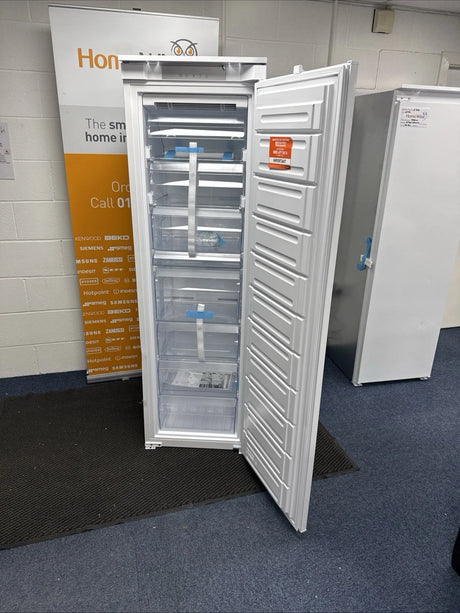 Hotpoint HTSD18F013H1 209 Litre Tall Built-In Freezer with No Frost - E Rated from HomeWise Appliances. Shop photo of the tall freezer with door open showing the inside.