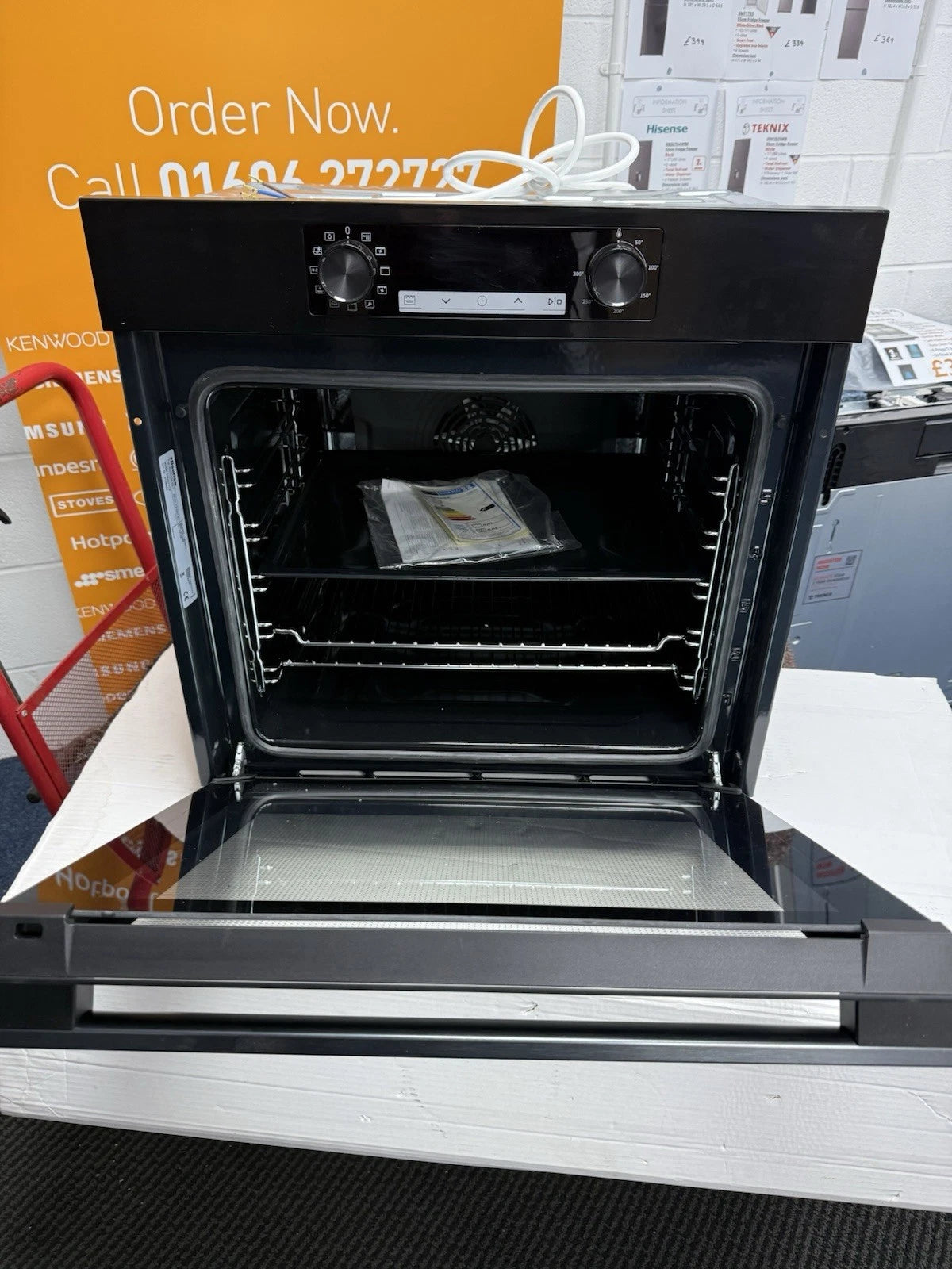 Hisense BI62211CB (40) Electric Single Oven in Black - A Rated - HW181540 shop photo front of oven with the door open.