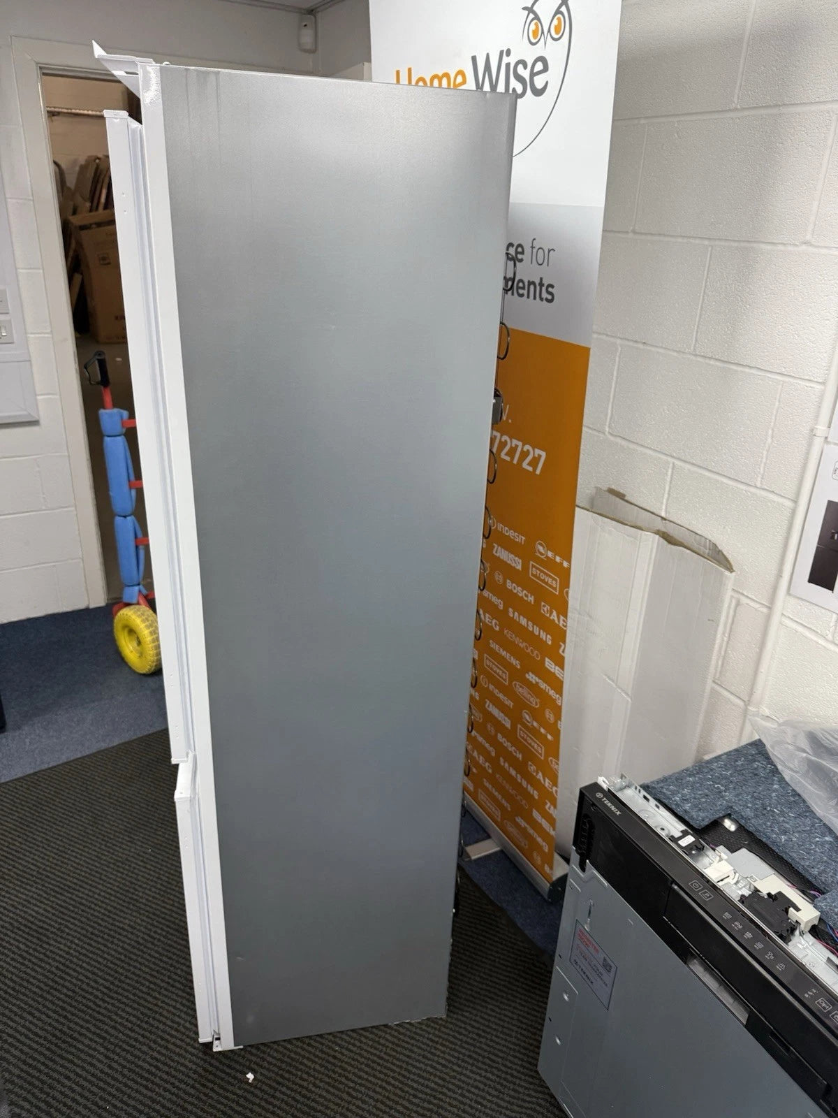 Hotpoint HTC18 T112 UK 70/30 No Frost Integrated Fridge Freezer with Sliding Hinge - E Rated from HomeWise Appliances. Shop phot of right side panel of the fridge freezer.