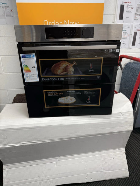 Samsung NV7B5755SAS Flexible Dual Cook Built-in Smart Single Oven with Pyrolytic Self Cleaning and Air Fry in Stainless Steel - A+ Rated from HomeWise Appliances. Shop photo of front of the oven with Dual Cook branding.